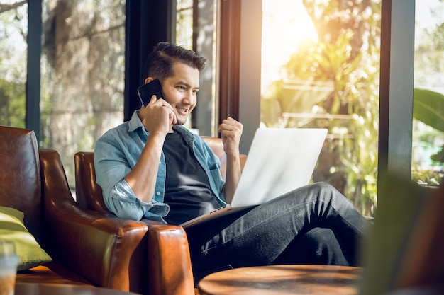 Asian freelancer in blazer with laptop in cafe near window Profession is blogger freelance translator and writer Freelance translator works in coffee shop online learning