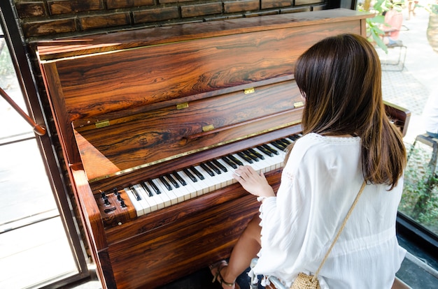 Asian girl playing piano