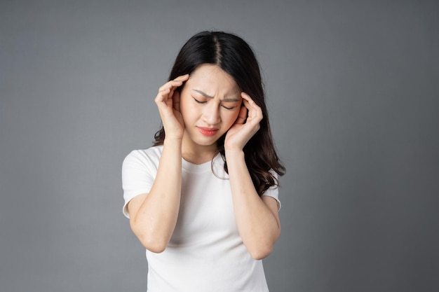 Asian girl portrait, isolated on gray background