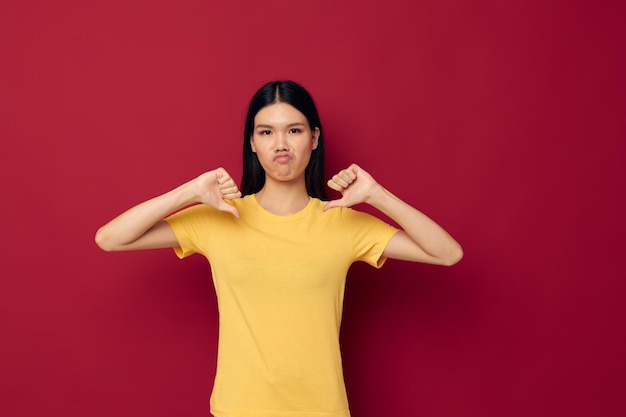 Asian girl posing on a colored background different emotions