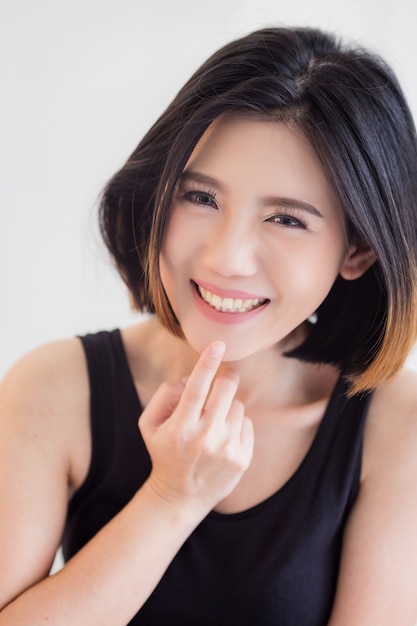 asian girl smiling and laughing with black tshirt