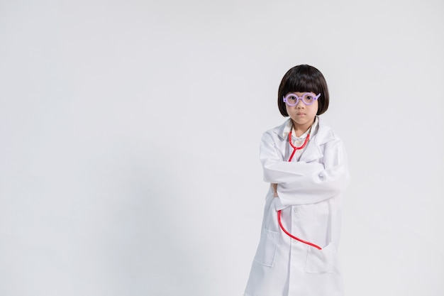 Asian girl wearing doctor clothes