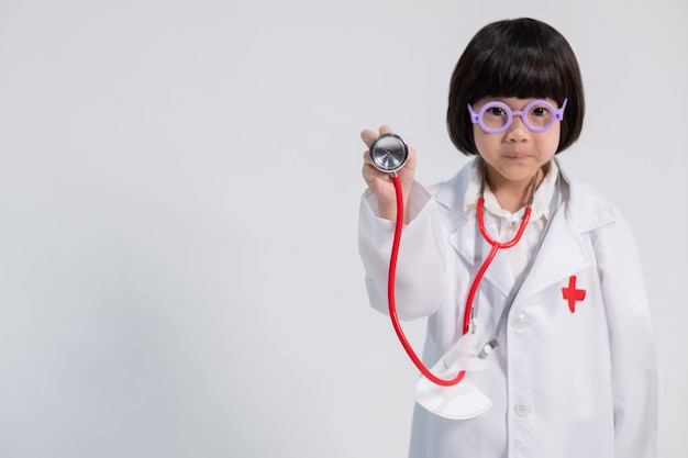 Asian girl wearing doctor clothes