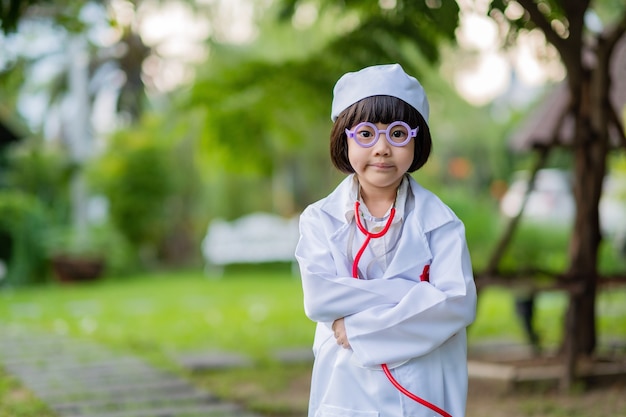 Asian girl wearing doctor clothes