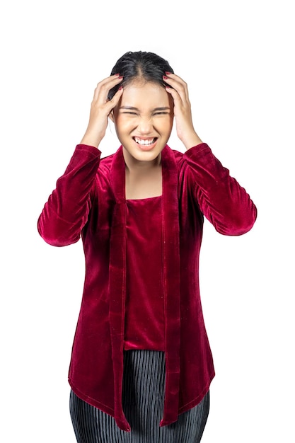 Asian girl wearing red kebaya traditional clothes feeling headache