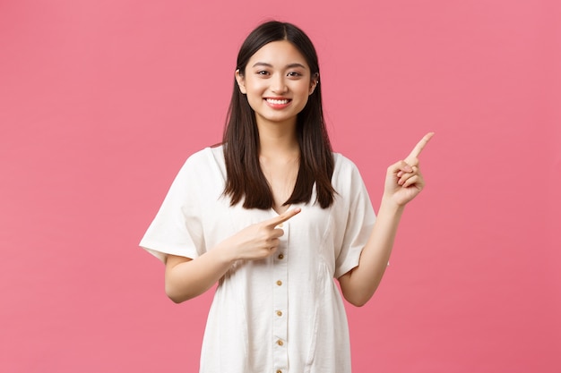 Asian girl in a white dress posing