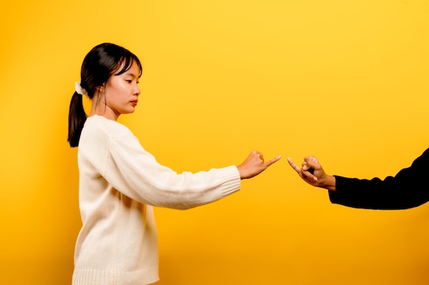 Asian girls holding hands expressing sincerity and solidarity with each other. mutual trust team 