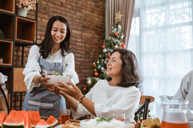 Asian happy family celebrating Christmas together at home