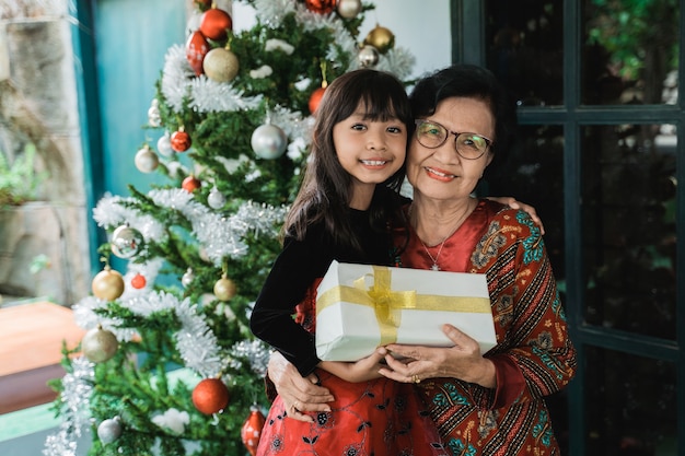 Asian happy family celebrating Christmas together at home