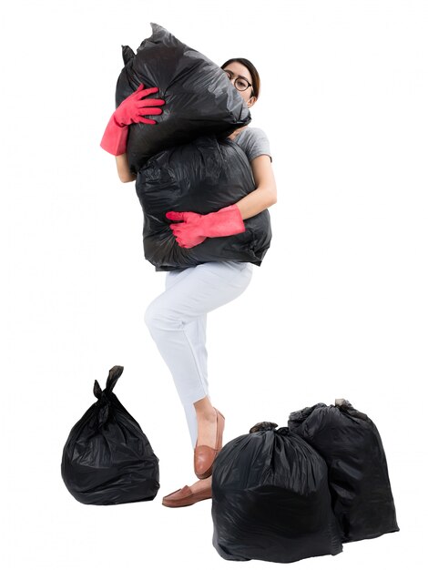 Asian housewife holding garbage bags isolated on white