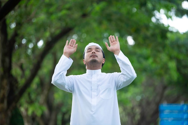 Asian islam man prayer,Young Muslim praying,Ramadan festival concept