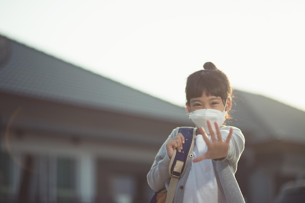 Asian kid girl wearing mask show stop hands coronavirus covid19 coronavirus