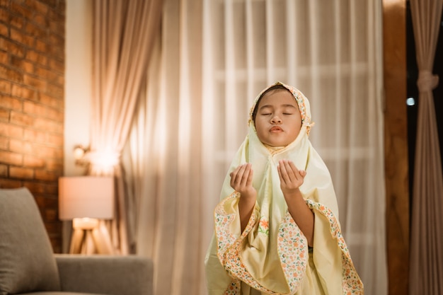 Asian kid muslim praying