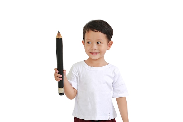 Asian little boy holding big pencil and looking up isolated on white background. Kid and education concept