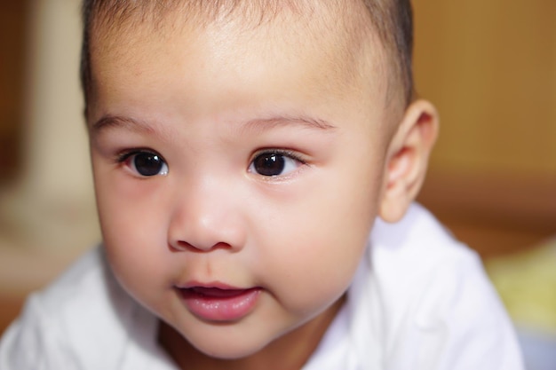 An Asian little cute baby is smiling happiness The concept of empathy adorable and pretty