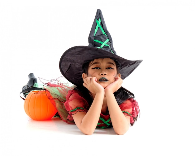 Asian little girl in costume of witch isolated on white background