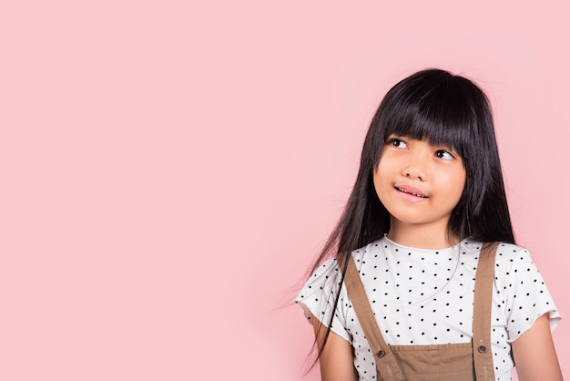 Asian little kid 10 years old looking away to side natural expression