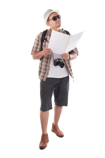 Asian male backpacker tourist wearing hat sunglasses camera and backpack Looking at map