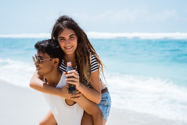 Asian man carrying their women on their back