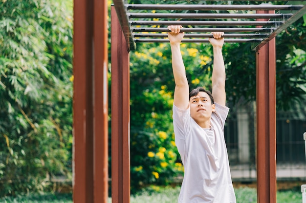 Asian man exercising in park