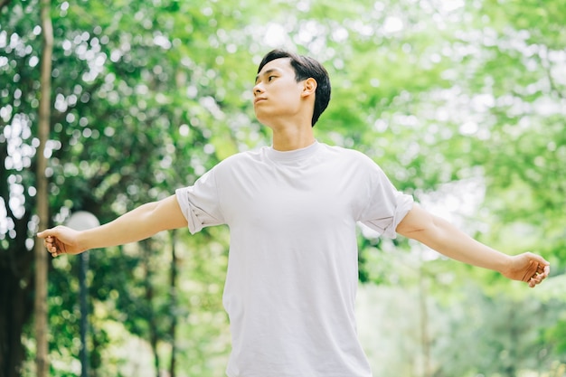 Asian man exercising in park