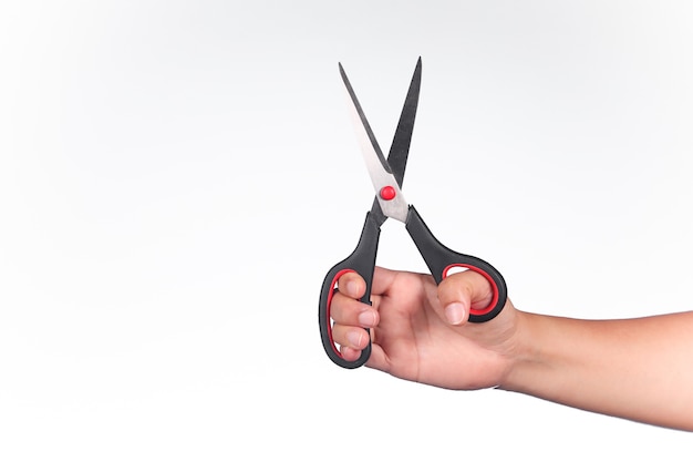 Asian man hold a scissor on a white background