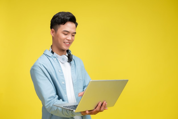 Asian man holding the computer