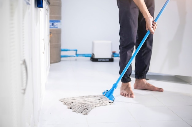 Asian man inspection cleaning staff in kitchen, bathroom blurry