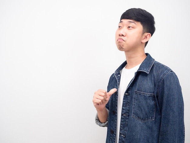 Asian man jean shirt point finger at himself arrogant face looking at copy space