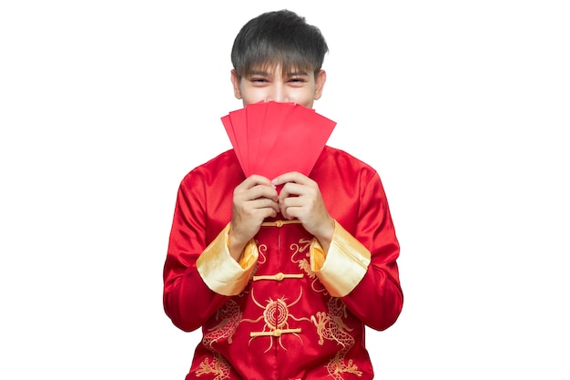 Asian man in mandarin collar dress holding red envelope packet. Chinese new year concept.