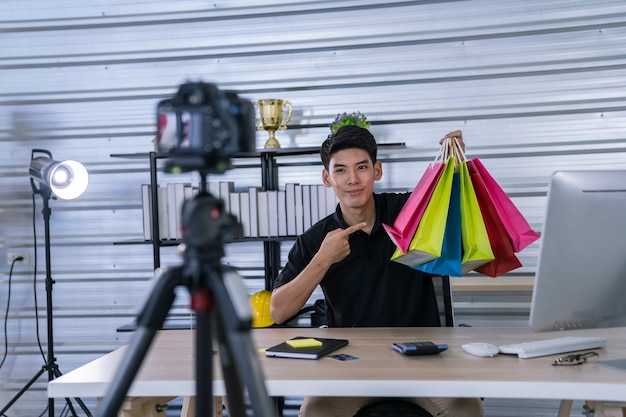 asian man present a products to online market