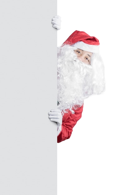 Asian man in Santa costume showing empty board isolated over white background. Empty board for copy space