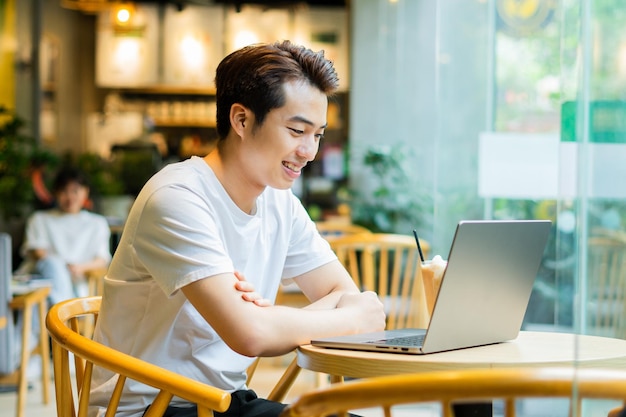 Asian man sitting at coffee shop