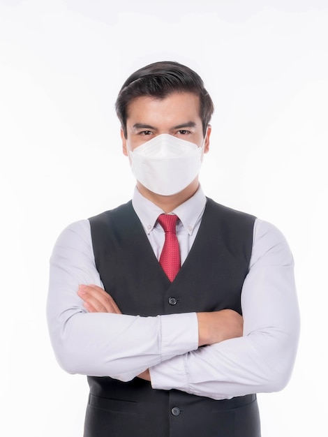 Asian man standing arms crossed , wearing Face Mask protect spread Covid-19 Coronavirus - stop Covid-19 Coronavirus and protect pm 2.5 concept