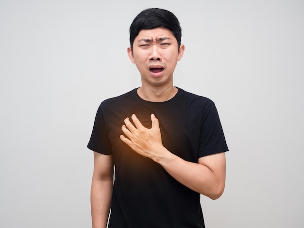 Asian man touch his chest feels pain his heartMan heart disease