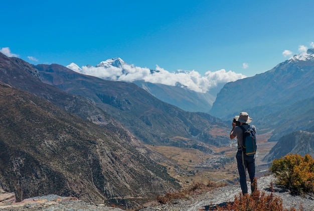 Asian man trekker in valley of Everest base camp trekking route in Khumbu