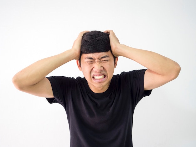 Asian man very headache touch head two hand sad at face black shirt on white isolate background