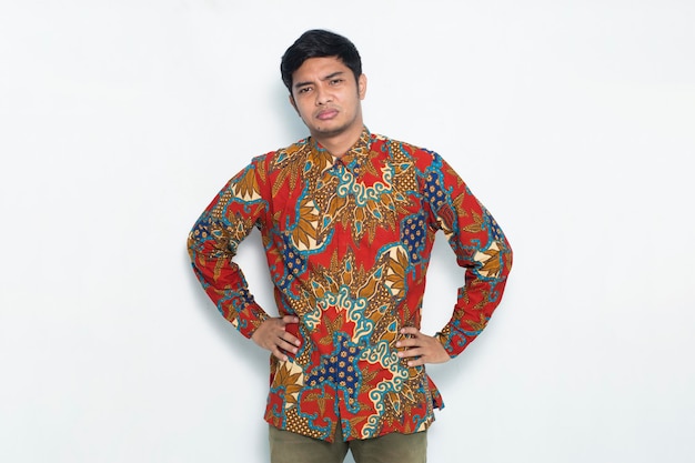 Asian man wearing batik feel disappointed isolated on white background