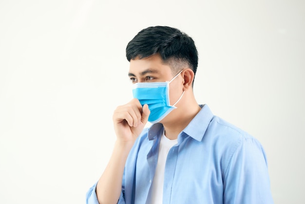 Asian man wearing a face mask with coughing