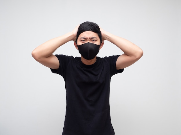 Asian man with mask strain and touch his head on white background