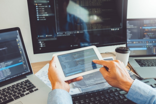 Asian man working from home using smartphone