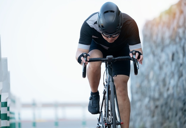 Asian men are cycling road bike in the morning.