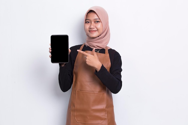 Asian muslim Barista waitress demonstrating mobile cell phone on white background