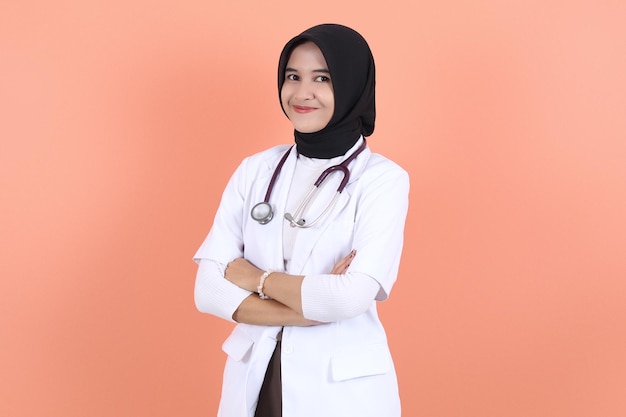 asian muslim beautiful female doctor in white coat with stethoscope waist up Woman hospital worker