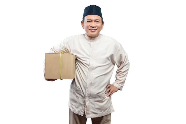 Asian Muslim man carrying box ready to mudik