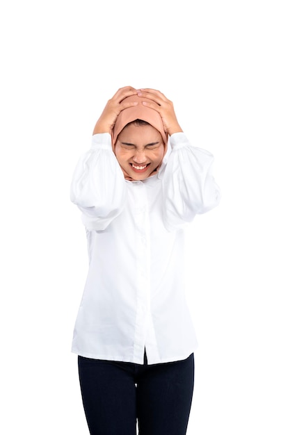 Asian Muslim woman in a headscarf feeling headache