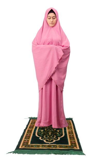 Asian Muslim woman in veil in praying position salat isolated over white background