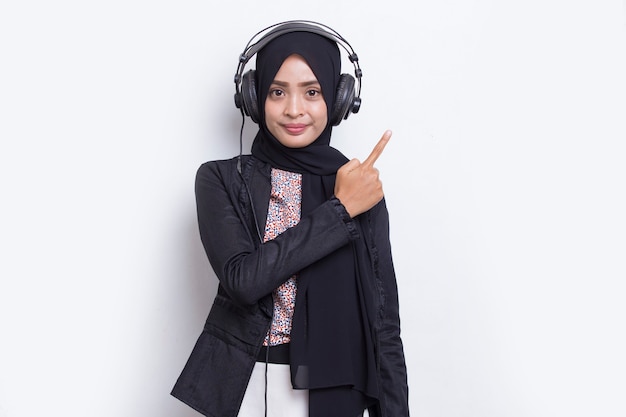 Asian muslim woman wearing hijab operator customer service pointing with fingers to directions