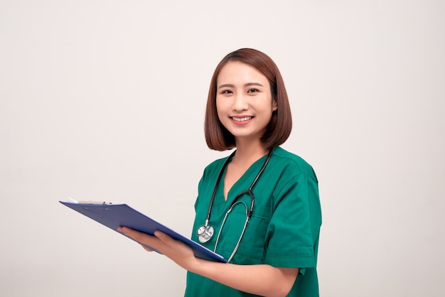 Asian nurse woman with a folder , isolated on white 