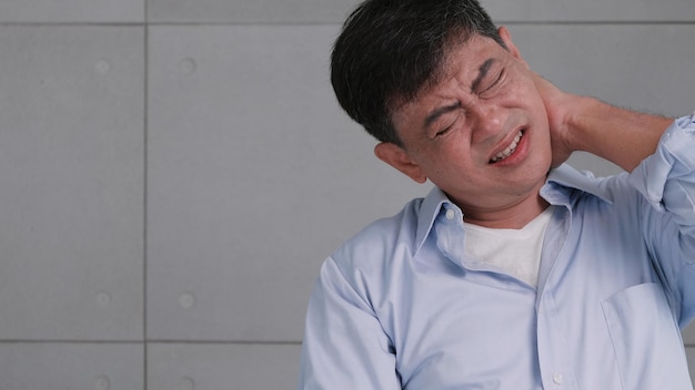 Asian old man with neck pain